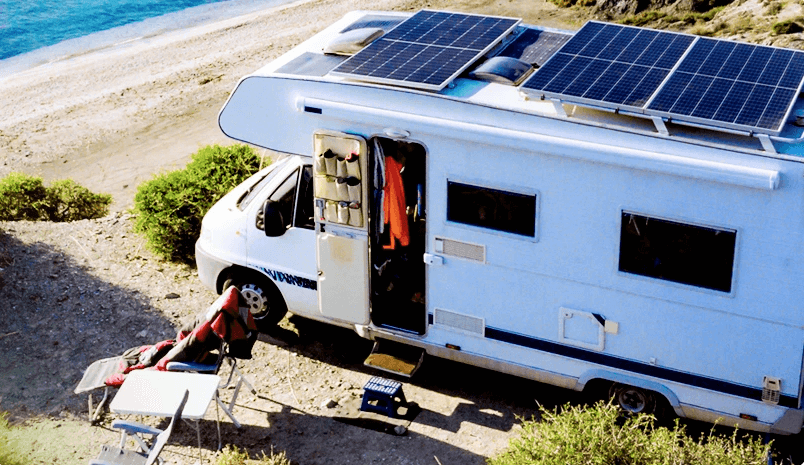 Portable solar panel kit on RV roof in desert